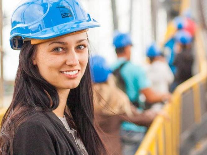Woman wearing a hard hat at a construction site